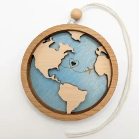 Engraved maple wood travel globe and airplane ornament by Foxwood Gifts hanging by twine
