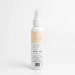Spraying a natural aloe and lavender after sun mist onto sun-exposed skin