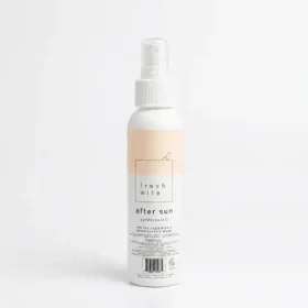 Spraying a natural aloe and lavender after sun mist onto sun-exposed skin