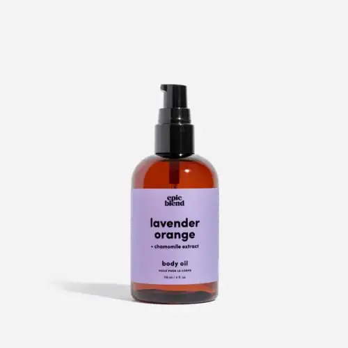 Fast absorbing all natural body oil being applied to skin