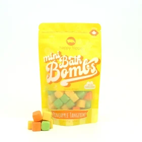 Bag of Happy Hippo Bath Co Pineapple Tangerine Mini Bath Bombs with colorful cubes