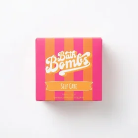 Box of Happy Hippo Bath Co Self Care Cube Bombs featuring yellow and pink cubes