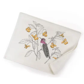 Absorbent hummingbird flour sack cotton kitchen towel hanging neatly on a modern oven handle