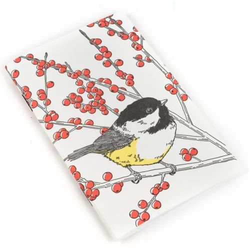 Porchlight Press Chickadee Pocket Notebook lying flat on a plain white background