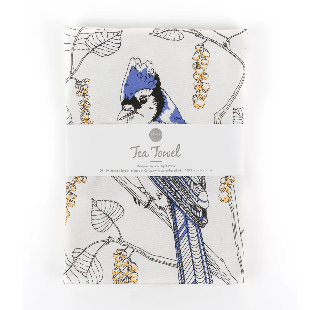 Blue Jay Tea Towel Absorbent blue jay flour sack cotton kitchen towel hanging neatly on a rustic wooden rack