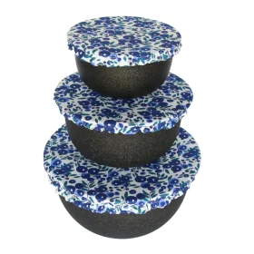 Colibri reusable fabric bowl cover set fitted over three different sized bowls in a kitchen