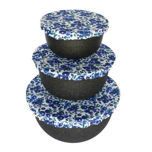 Colibri reusable fabric bowl cover set fitted over three different sized bowls in a kitchen
