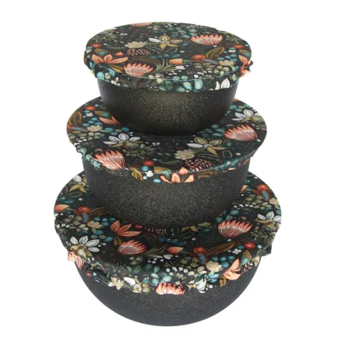 Colibri reusable fabric bowl cover set fitted over three different sized bowls in a kitchen