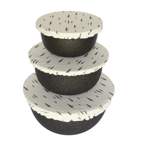 Colibri reusable fabric bowl cover set fitted over three different sized bowls in a kitchen
