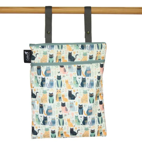 Colibri reusable fabric double duty wet bag zipped shut showing the hanging snap straps