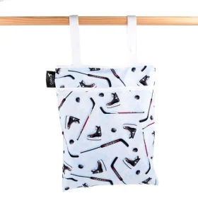 Sac étanche réutilisable en tissu Colibri à double usage, fermé par une fermeture éclair laissant voir les sangles de suspension à pression.