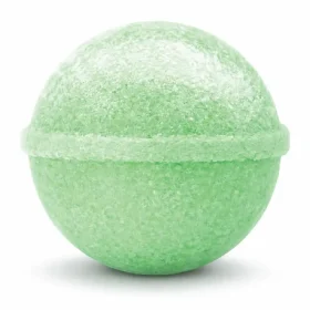 Shimmering lime green margarita cocktail bomb fizzing in a glass of sparkling water