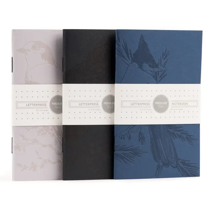Monochromatic Birds - Pocket Size Set of 3 Notebook Set of three Porchlight Press Monochromatic Birds pocket notebooks displaying the Steller's Jay, Whiskey Jack, and Raven designs