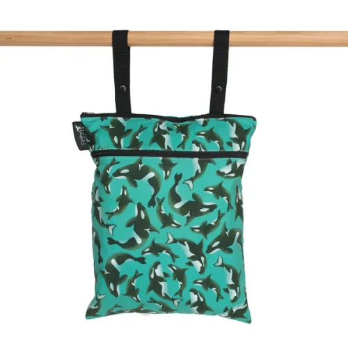 Colibri reusable fabric double duty wet bag zipped shut showing the hanging snap straps