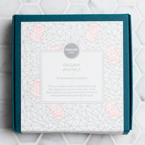 Twelve pack of Porchlight Press Origami Theme letterpress coasters displaying minimalist geometric designs