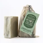 Close-up of Blooming Wild Pumice Foot Soap bar showing pumice texture against a pure white background