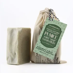 Close-up of Blooming Wild Pumice Foot Soap bar showing pumice texture against a pure white background