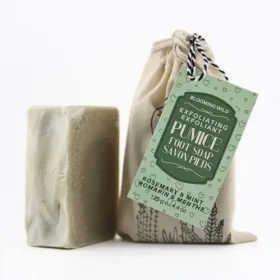 Close-up of Blooming Wild Pumice Foot Soap bar showing pumice texture against a pure white background