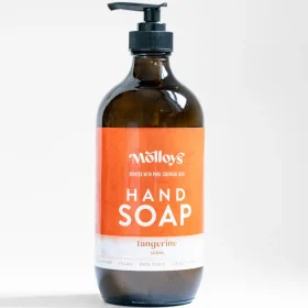 Molloy's 500ml tangerine hand soap in a reusable glass dispenser