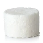 Unpackaged solid dish soap refill cake resting