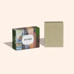 Anto Yukon Log Cabin Exfoliating Soap bar in artistic paper packaging standing on a plain white background