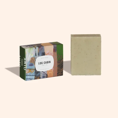 Anto Yukon Log Cabin Exfoliating Soap bar in artistic paper packaging standing on a plain white background