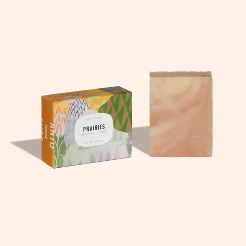 Anto Yukon Prairies Bar Soap in artistic illustrated paper packaging standing on a plain white background