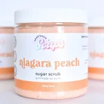 Small Batch Soaps Niagara Peach Sugar Scrub jar standing on a plain white background