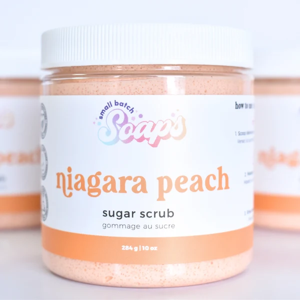Small Batch Soaps Niagara Peach Sugar Scrub Small Batch Soaps Niagara Peach Sugar Scrub jar standing on a plain white background