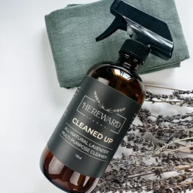 Hereward Farms All-Natural Cleaner spray bottle on a wooden kitchen counter