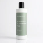 Bouteille d’OC Beauty Co. Après-shampoing à la menthe poivrée au romarin