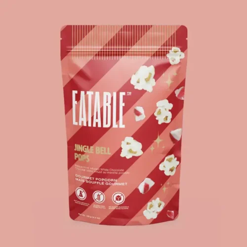 Jingle Bell Pops white chocolate Christmas popcorn by EATABLE, peppermint infused with candy cane crystals, 125 g bag, made in Canada