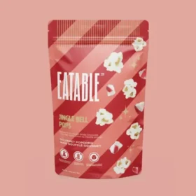 Jingle Bell Pops white chocolate Christmas popcorn by EATABLE, peppermint infused with candy cane crystals, 125 g bag, made in Canada
